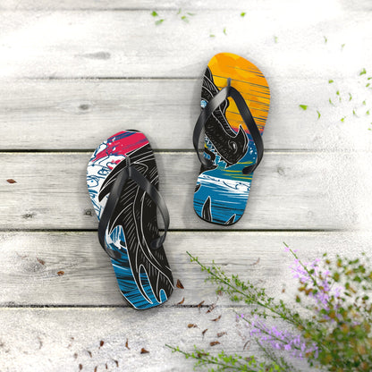 Flip flops on a light concrete surface, dragon print footbeds, black thong straps.