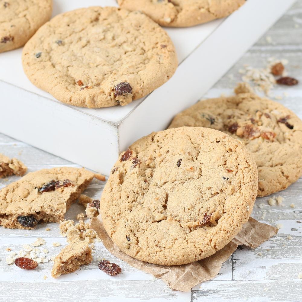 Mixed cookies assortment with crumbs on paper, gift tin selection
