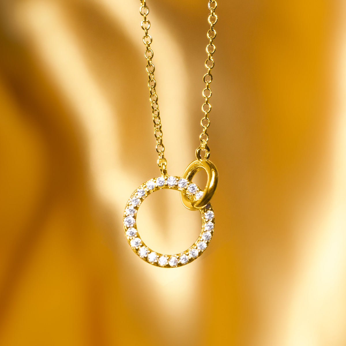 18K gold-plated open circle pendant necklace with pavé stones and oval loop