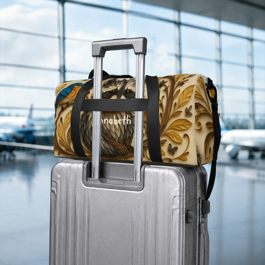 Raccoon print duffel bag secured on a rolling suitcase with black strap