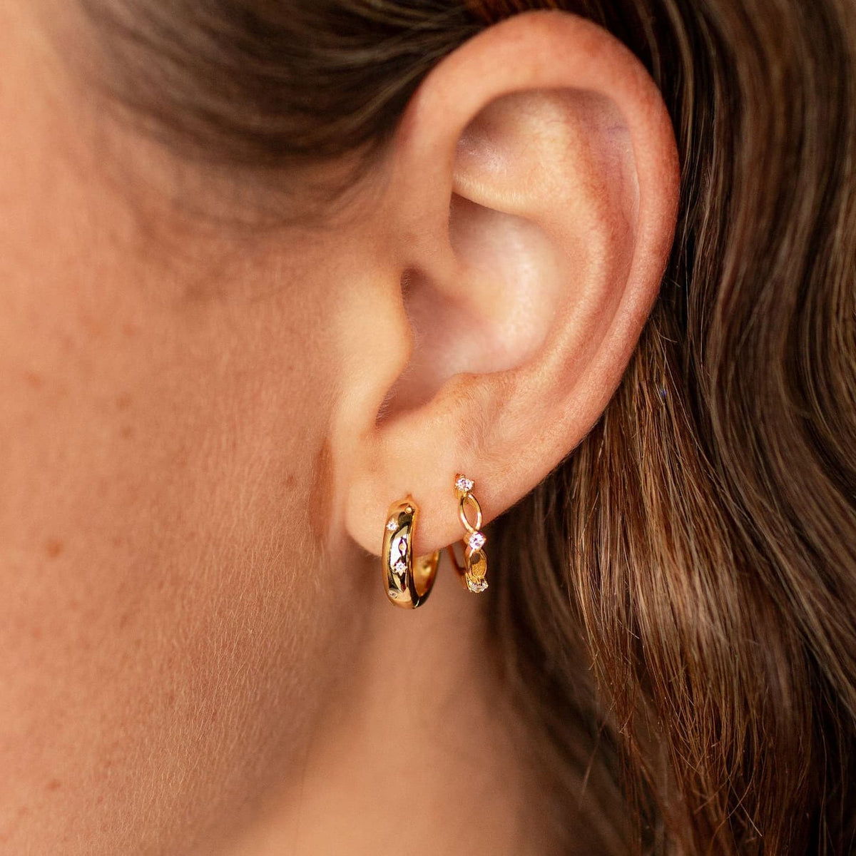 Charli gold vermeil hoop earring with clear cubic zirconia, worn with a delicate drop earring