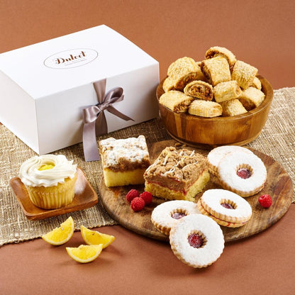 Wedding gift basket with assorted pastries: cookies, lemon cupcake, and fruit-topped treats