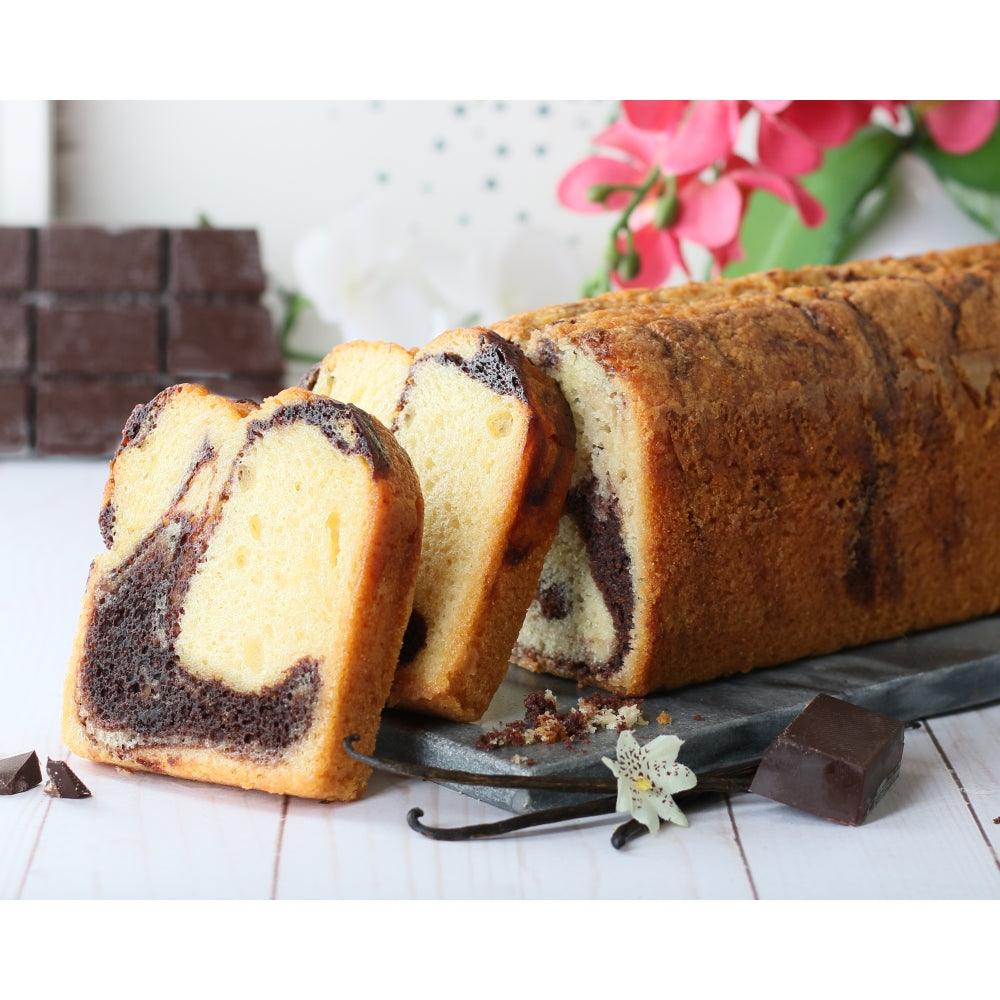 Sliced cake loaf with marbled dark filling on a serving tray