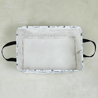 Rectangular canvas storage bin with cat print trim and two side carrying handles