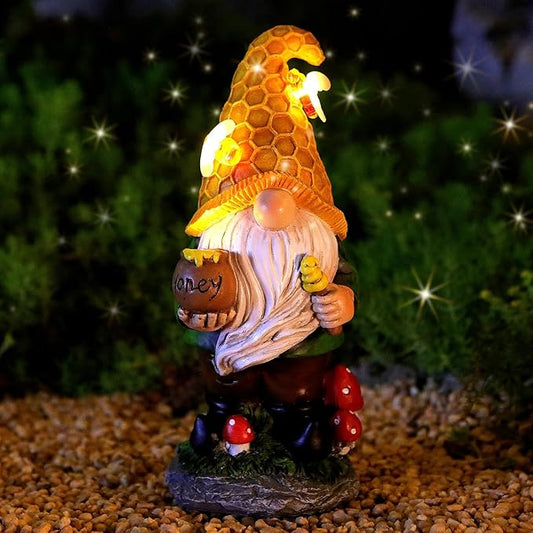 Solar LED garden gnome statue holding honey pot, orange hex cap, red mushroom base