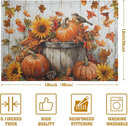 Cotton-linen placemat close-up with pumpkins, sunflower, bird, pinecone, and autumn leaves