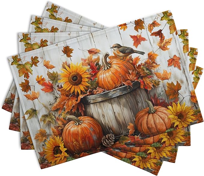 Set of cotton-linen placemats with overlapping pumpkins, sunflower, bird and orange leaf print