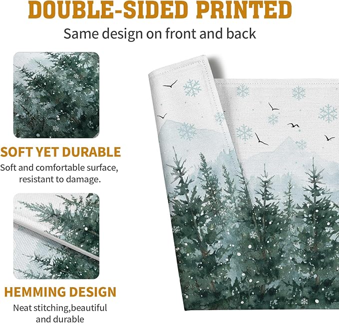 Set of 4 placemats printed with snowy pine trees and snowflakes on both sides