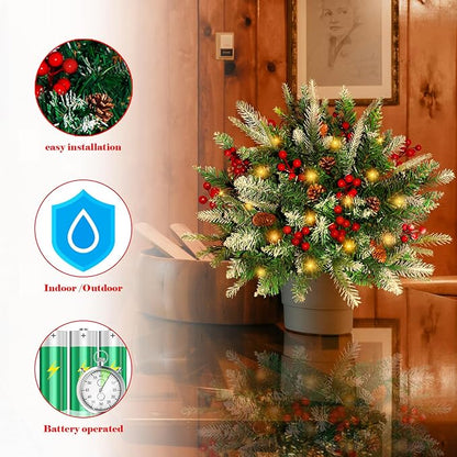 Battery-operated pre-lit artificial pine tree decoration with red berries and warm glowing lights