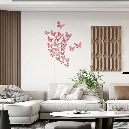 Red 3D butterfly wall decals arranged on a wall above a sofa