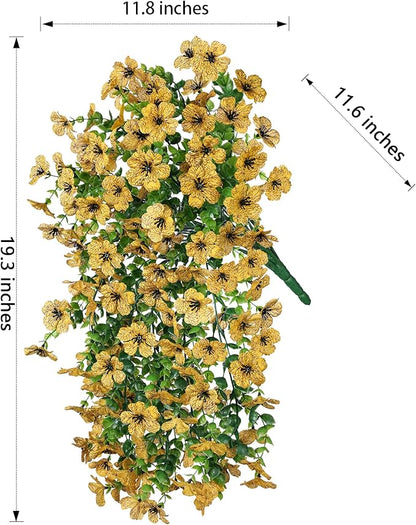 Yellow faux daisy hanging flower bundle with trailing green eucalyptus-style leaves