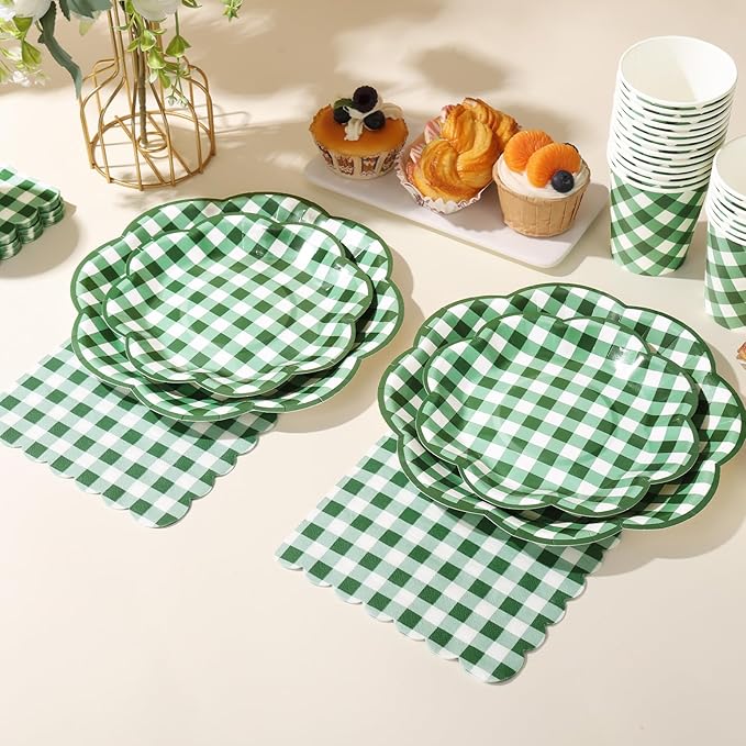 Green-and-white gingham picnic tableware with round plates, cups, and matching napkins