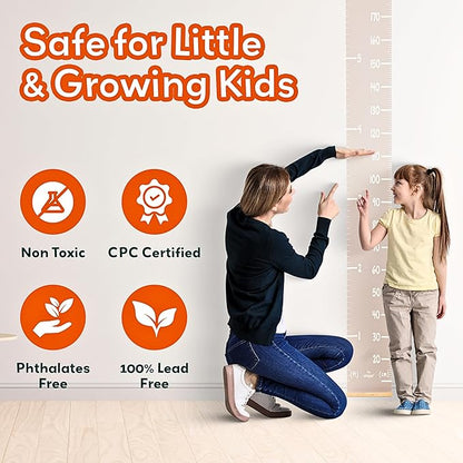 Children measuring with wall height chart; non-toxic and lead-free safety icons