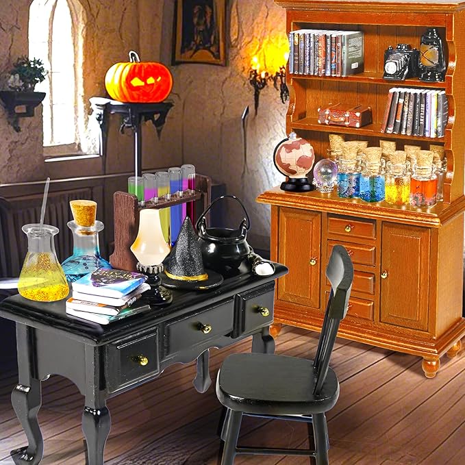 Witchy dollhouse miniature potion table with cauldron items, broom, and nearby bookcase