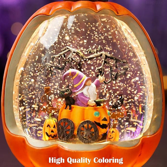 Orange pumpkin snow globe with swirling glitter, purple-costumed figure, and bat decor