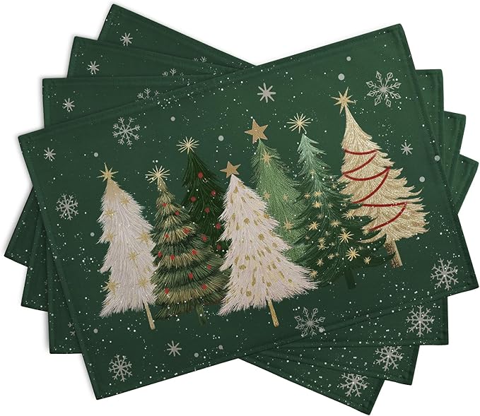 Set of green holiday placemats with layered pine trees, stars, and snowflakes