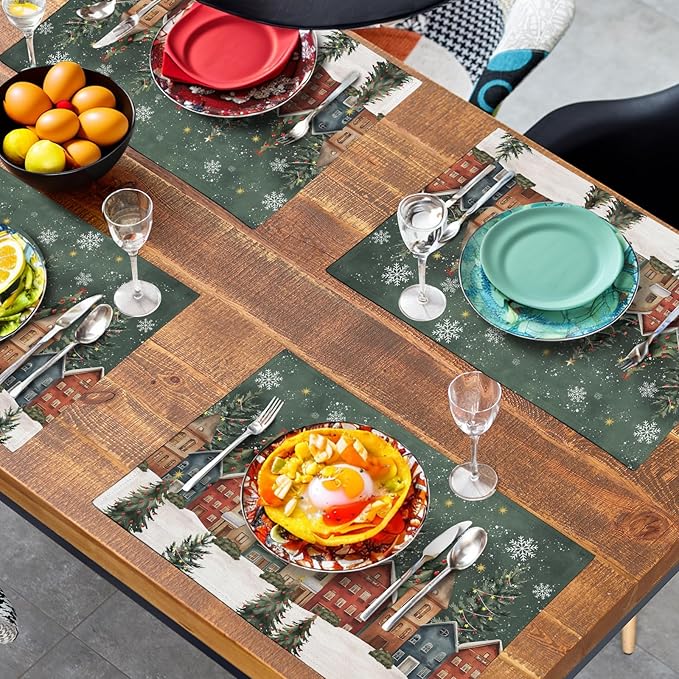 Green Christmas placemats on dining table with appetizers, glasses, and plates