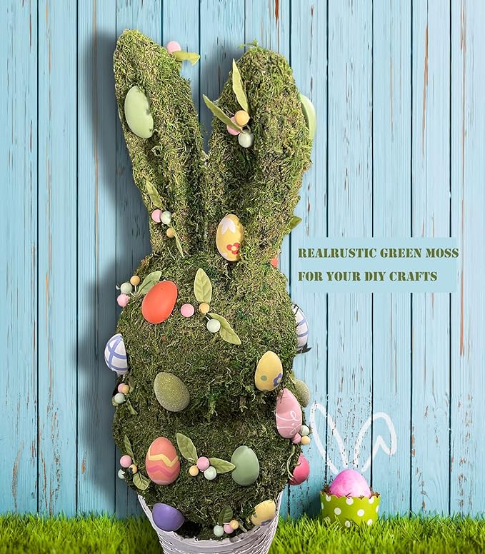 Light green faux moss wreath-shaped filler with decorative spring eggs and leaves