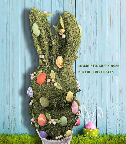 Light green faux moss wreath-shaped filler with decorative spring eggs and leaves