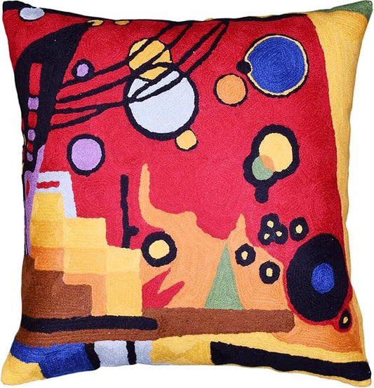 Red abstract embroidered pillow cover with geometric shapes and blue circle motifs