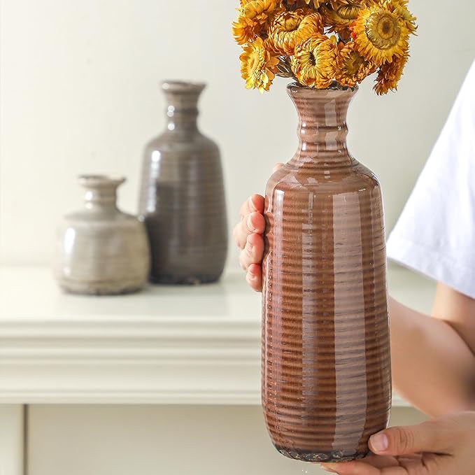 Set of 3 fluted ceramic vases, terracotta brown and stone-gray, held upright