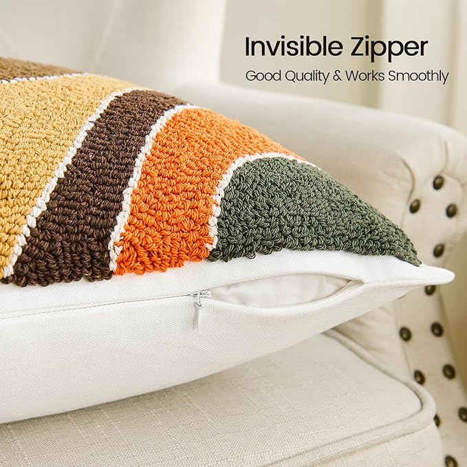 Pillow cover with invisible zipper opening and tufted stripes in tan, brown, dark green, orange