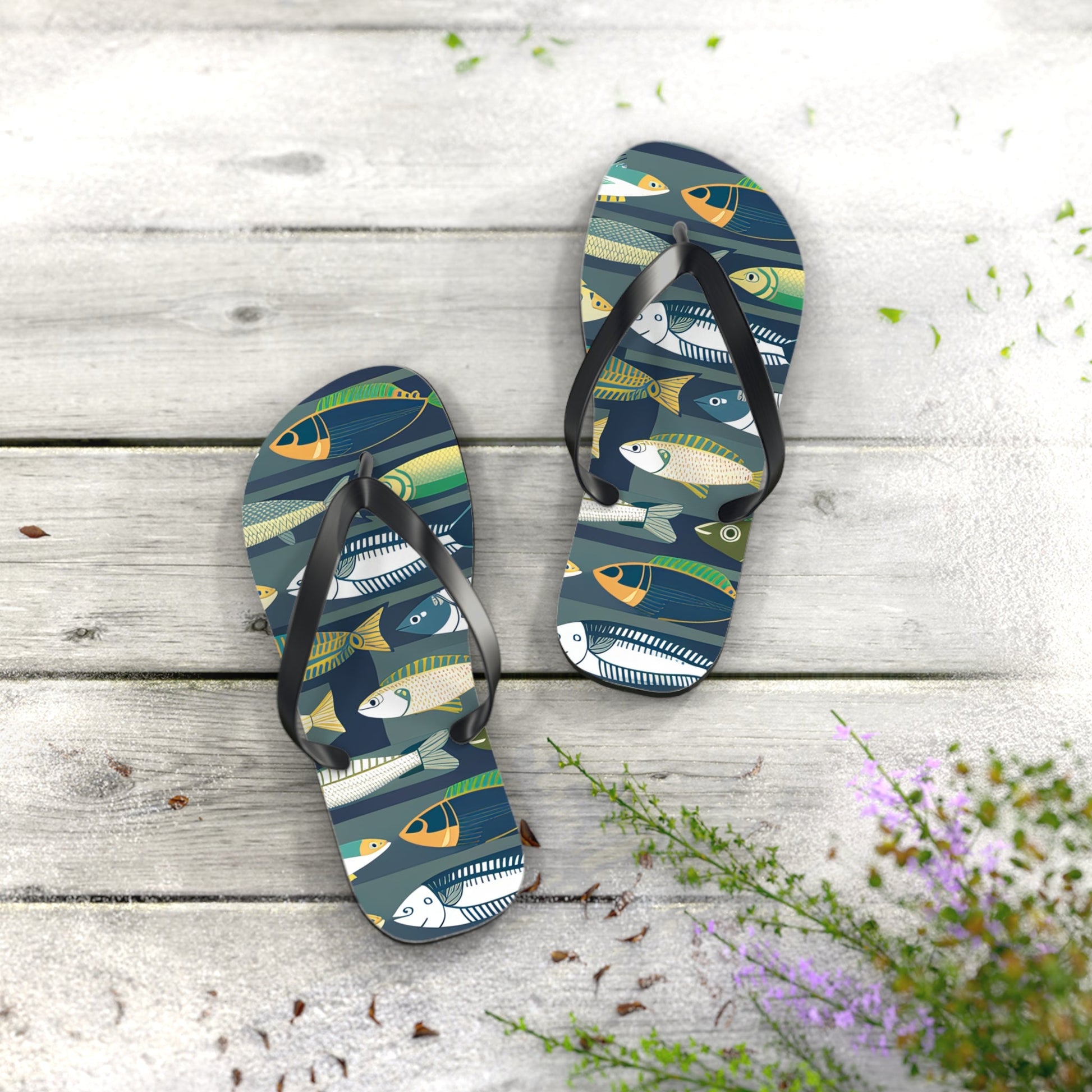 Pair of fish-print flip flops with black straps and dark blue patterned footbeds