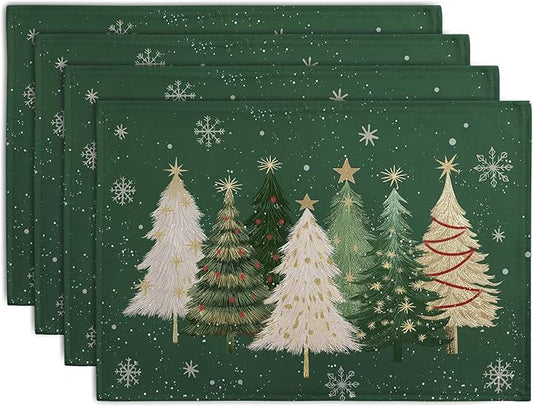 Set of green Christmas placemats with white and red pine trees and snowflake prints