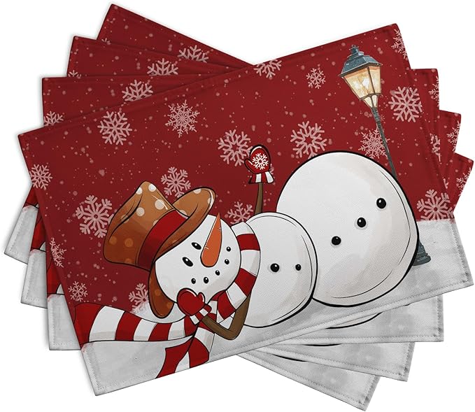 Set of 4 red Christmas placemats featuring snowman and snowflakes, angled stack