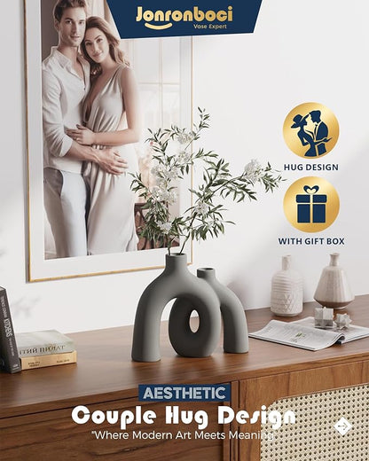 Dark gray matte ceramic conjoined hug vase sculpture with oval donut cutout