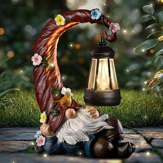 Garden gnome solar light statue with flowered vine arch, glowing black lantern on ground