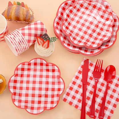 Red and white gingham plates and napkins with cups and red forks, spoons, and knives