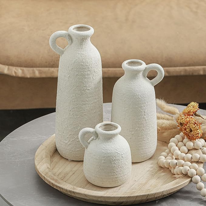 Set of 3 white ceramic vases with loop handles, rounded bases and textured finish