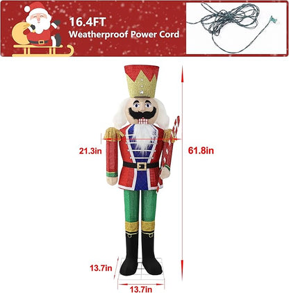 Standing lit nutcracker soldier in red and green holding a candy cane