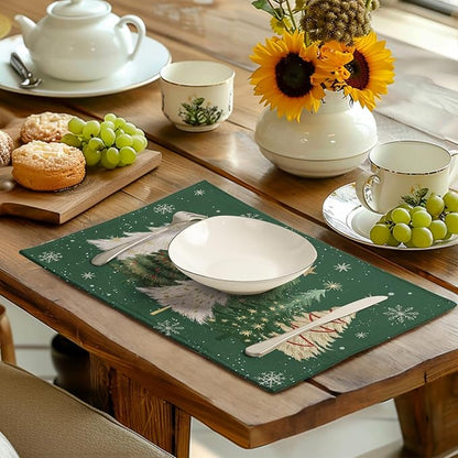 Green Christmas placemat with pine tree and snowflake design on dining table