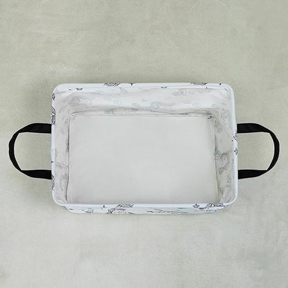 Rectangular collapsible canvas storage bin, white with small unicorn print, top view