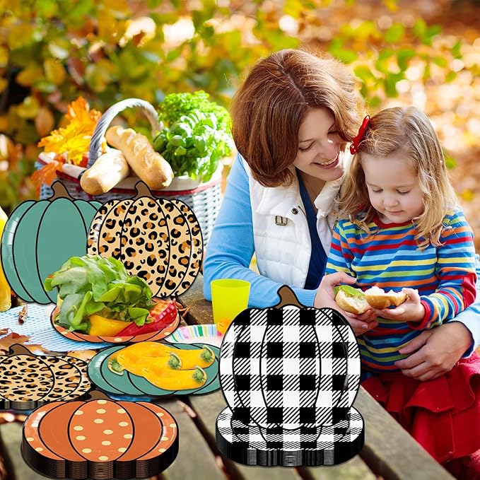 Pumpkin-shaped paper party plates with leopard, teal, and black-and-white plaid patterns