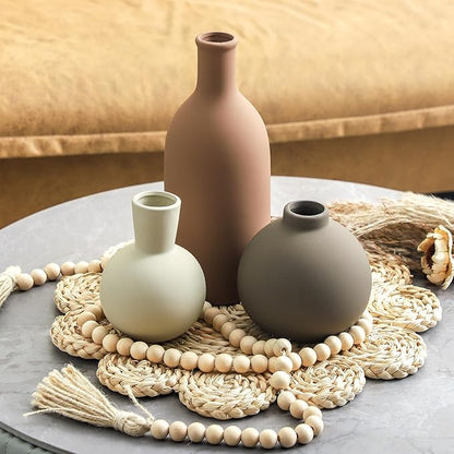 Set of 3 ceramic vases: tall terracotta-brown, white bulb, and taupe round vase