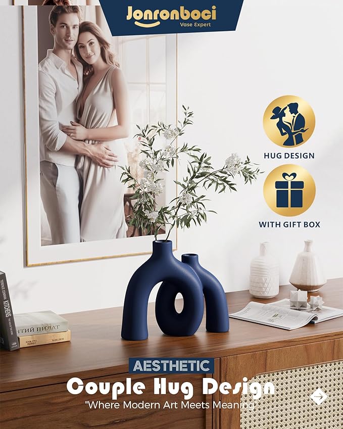Matte navy ceramic conjoined hug vase, rounded donut opening design.