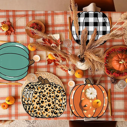 Pumpkin-shaped paper party plates featuring leopard, orange polka, teal, and black plaid