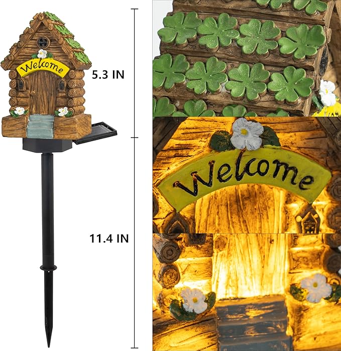 Mini welcome fairy cottage garden light with green leaf roof and glowing door, on black stake.