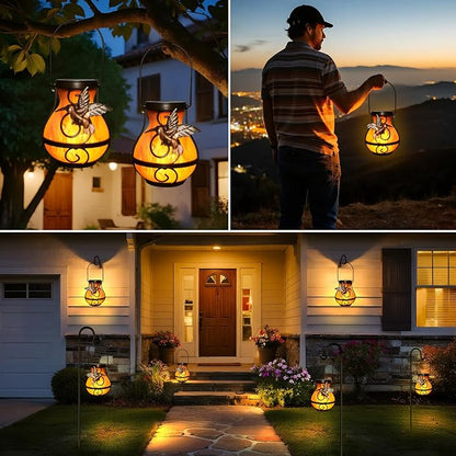 Solar hanging lanterns, two glowing orange amber bird-and-angel flame style lights