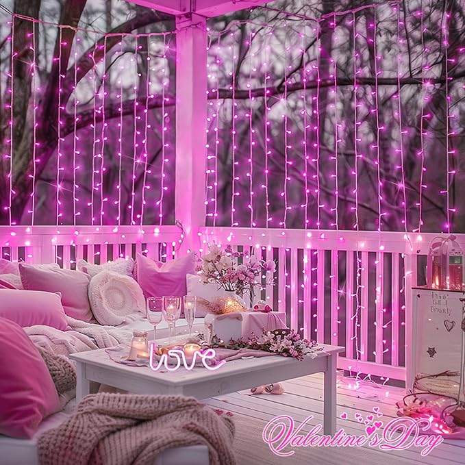 Pink LED curtain lights with vertical strands on a window and fence panel