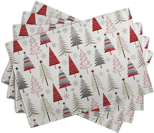 Stack of 4 holiday placemats with Christmas tree, star, and stripe pattern in red/gray