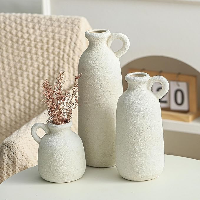 Set of 3 white ceramic vases with loop handles, varying heights with speckled texture
