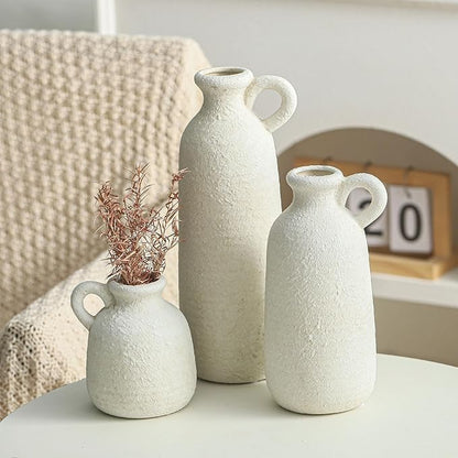 Set of 3 white ceramic vases with loop handles, varying heights with speckled texture
