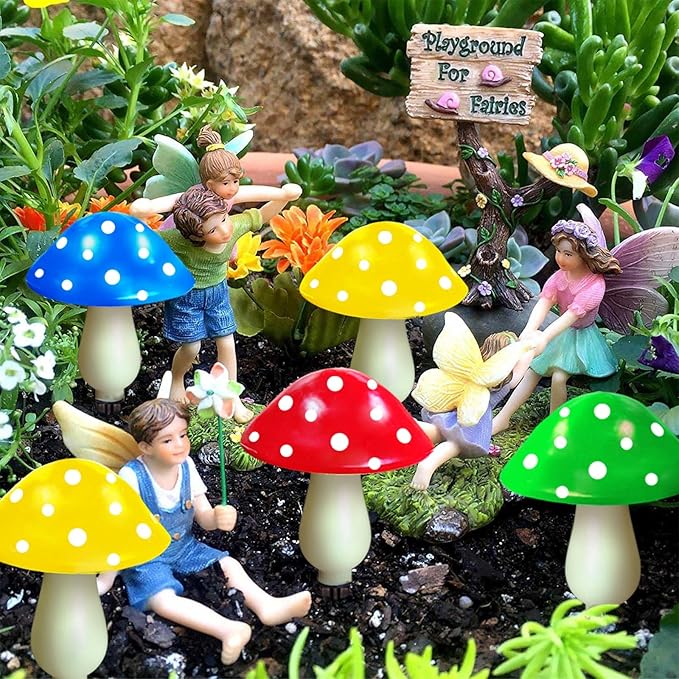 Solar mushroom LED lights with dotted caps in a garden scene with decorative figures