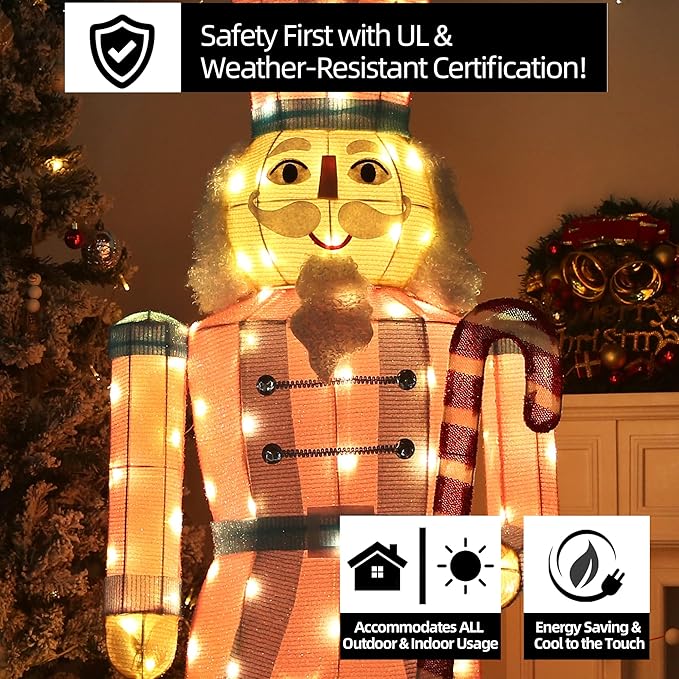 LED-lit nutcracker yard stake with glowing face, red-and-white coat, and orange hat lights