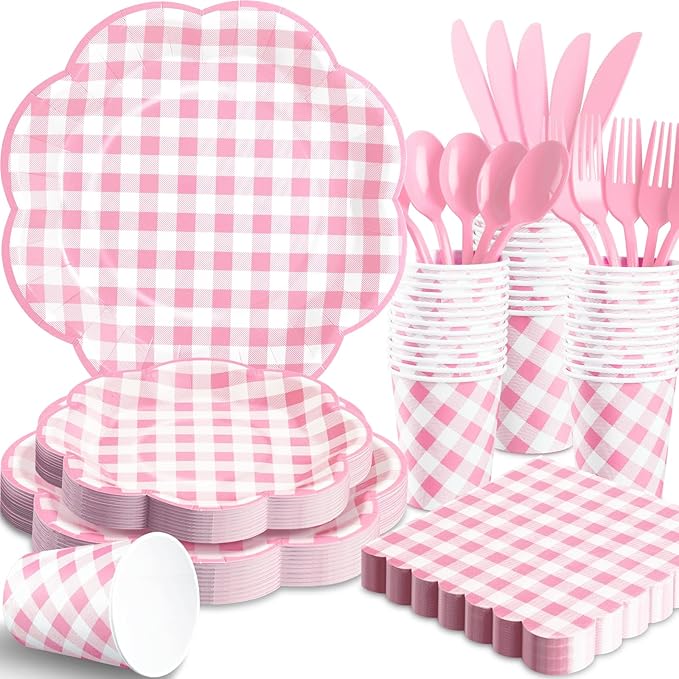 Pink gingham picnic tableware set: stacked plates, cups, and cutlery