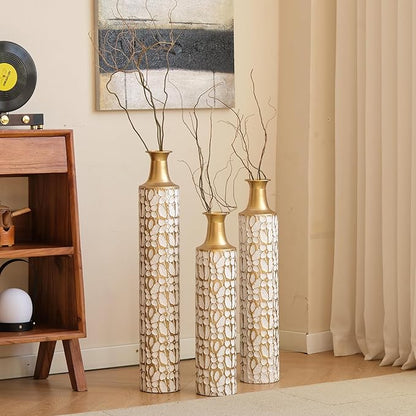 Set of three twig-pattern metal floor vases with antique white bodies and gold tops